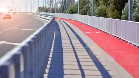 Bicycle path and sidewalk through the highway bridge.