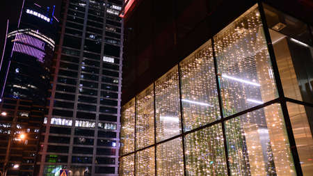 Warsaw, Poland. 8 January 2022. Night architecture, skyscraper with glass facade. Modern building in business district. Concept of economics, financial. Skyfall is a innovative office building.のeditorial素材