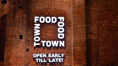 Warsaw Poland. January 8, 2022. Sign Food Town. Company signboard Food Town.のeditorial素材