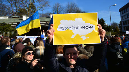 Warsaw, Poland. February 24, 2022. Anti-war protest outside Russian embassy in Warsaw. Demonstrators call for peace and condemn Putin.のeditorial素材