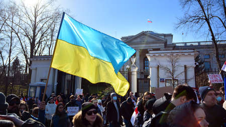Warsaw, Poland. February 24, 2022. Anti-war protest outside Russian embassy in Warsaw. Demonstrators call for peace and condemn Putin.のeditorial素材