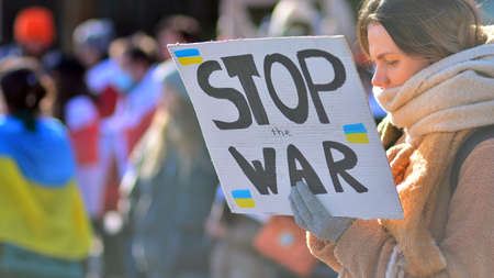 Warsaw, Poland. February 24, 2022. Anti-war protest outside Russian embassy in Warsaw. Demonstrators call for peace and condemn Putin.のeditorial素材
