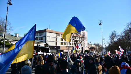 Warsaw, Poland. February 24, 2022. Anti-war protest outside Russian embassy in Warsaw. Demonstrators call for peace and condemn Putin.のeditorial素材