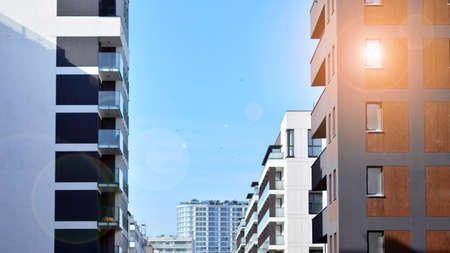 Fragment of modern residential apartment with flat buildings exterior. Detail of new luxury house and home complex.の写真素材