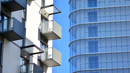 Fragment of modern residential apartment with flat buildings exterior. Detail of new luxury house...