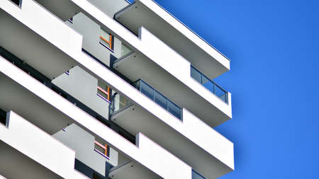 Fragment of modern residential apartment with flat buildings exterior. Detail of new luxury house and home complex.の写真素材