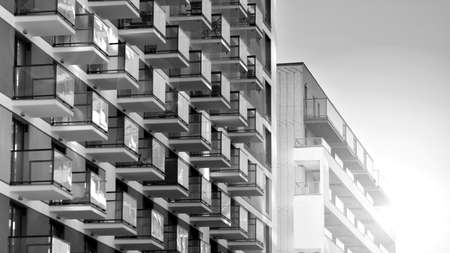 Fragment of modern residential apartment with flat buildings exterior. Detail of new luxury house...
