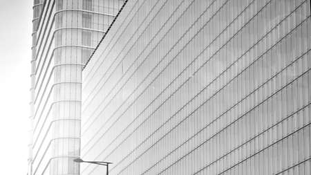 Glass facade of a modern housing construction with of balconies. Black and white filter.の写真素材