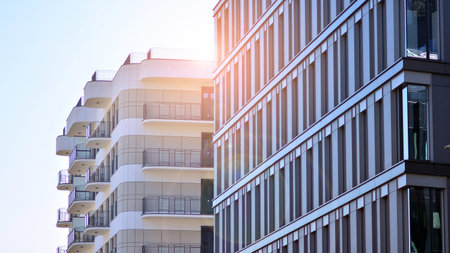 A residential building and an adjacent office building. Modern urban development.