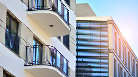 A residential building and an adjacent office building. Modern urban development.