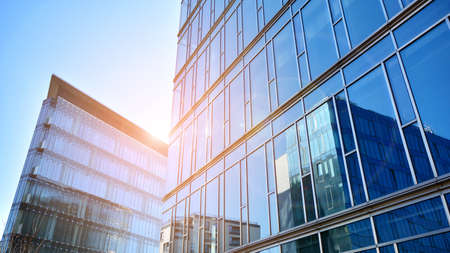 Perspective view to steel and blue glass. Commercial modern city of future. Business concept of...