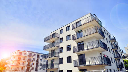 Apartment residential house and home facade architecture and outdoor facilities. Blue sky on the...