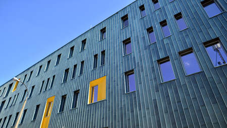 Fragment of modern urban geometry. Walls office building made of steel and glass.