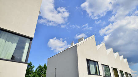 Modern geometric housing architecture. Sunlight on surface of apartment building, architecture...