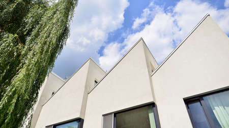 Modern geometric housing architecture. Sunlight on surface of apartment building, architecture...
