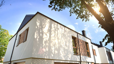 Terraced family home in newly developed housing estate. The real estate market in the suburbs.