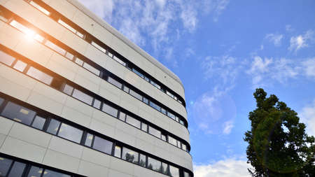 Fragment of modern urban geometry. Walls office building made of steel and glass. Bright sunny day...