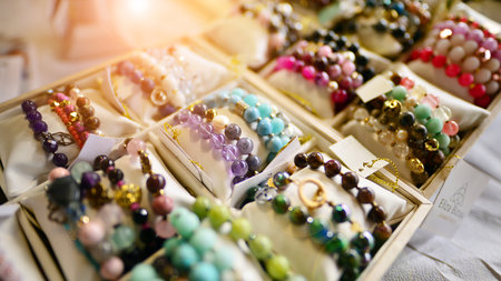 Esoteric and colorful background. Gemstone bracelets and necklaces. Healing, powerful crystal and...