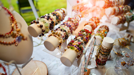 Esoteric and colorful background. Gemstone bracelets and necklaces. Healing, powerful crystal and...