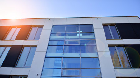 New apartment building on a sunny day. Modern residential architecture. The apartment is waiting for...