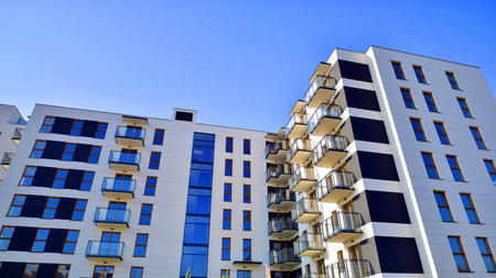 New apartment building on a sunny day. Modern residential architecture. The apartment is waiting for...
