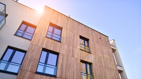 New apartment building on a sunny day. Modern residential architecture. The apartment is waiting for new residents.の写真素材