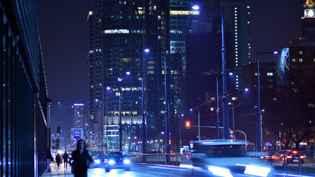 Warsaw, Poland. 23 November 2022. Evening city life in the center of Warsaw. cars on street. City street lights at night.のeditorial素材