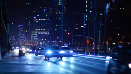 Warsaw, Poland. 23 November 2022. Evening city life in the center of Warsaw. cars on street. City street lights at night.のeditorial素材