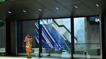Warsaw, Poland. 23 November 2022. Evening city life in the center of Warsaw. Large windows of the lobby of an Varso office building and empty corridor in the modern office buildingのeditorial素材