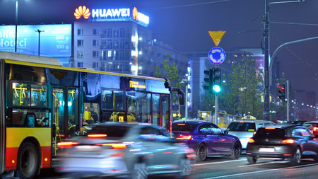 Warsaw, Poland. 23 November 2022. Evening city life in the center of Warsaw. cars on street. City street lights at night.のeditorial素材