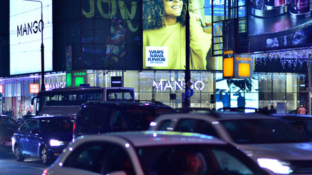 Warsaw, Poland. 23 November 2022. Evening city life in the center of Warsaw. cars on street. City street lights at night.のeditorial素材