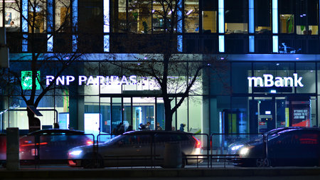 Warsaw, Poland. 23 November 2022. Evening city life in the center of Warsaw. cars on street. City street lights at night.のeditorial素材