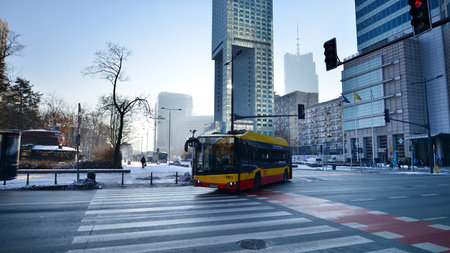Warsaw, Poland. 14 December 2022. Winter street of a big city. Downtown street traffic in Warsaw.