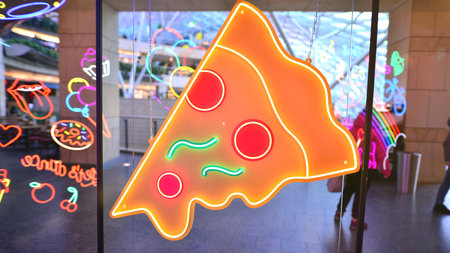 Warsaw, Poland. February 10, 2023. The interior of the Golden Terraces shopping center. Decorative neon lightsのeditorial素材