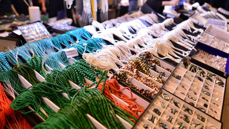 Warsaw, Poland. 5 March 2023. Warsaw Mineral Expo 2023. Colored stones of different sizes lying on a shelf. Exhibition of semi-precious stones.のeditorial素材