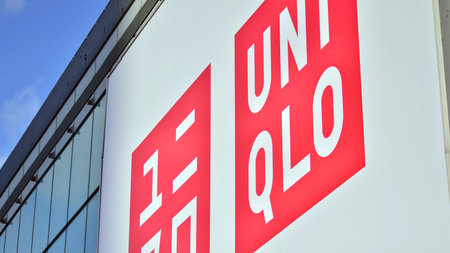 Warsaw, Poland. 8 March 2023. Sign Uniqlo. Company signboard Uniqlo.のeditorial素材