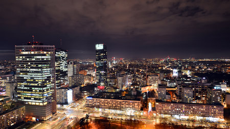 Warsaw, Poland. 14 March 2023. Beautiful architecture of Warsaw city center with modern skyscrapers at night.のeditorial素材