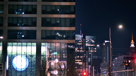 Warsaw, Poland. 29 March 2023. Signboard of the insurance company PZU on a glass facade of a modern office building.のeditorial素材
