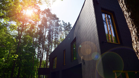 Upscale house in a wooded area. Fragment of a single-family house facade.