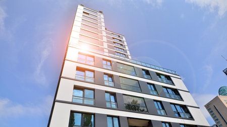 Modern apartment building on a sunny day with a blue sky. Facade of a modern apartment...