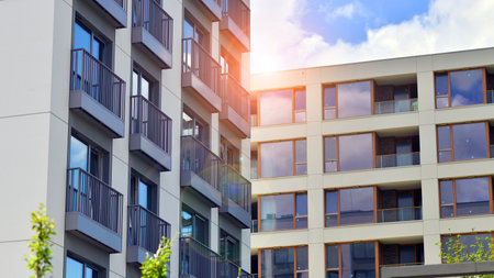 Modern apartment buildings on a sunny day with a blue sky. Facade of a modern apartment building