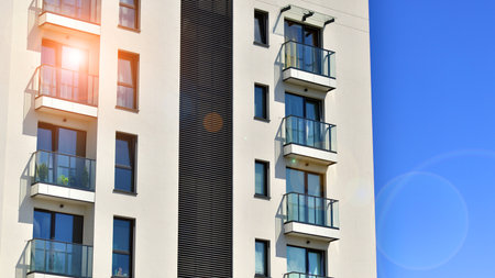 Modern apartment building on a sunny day. Exterior, residential house facade.