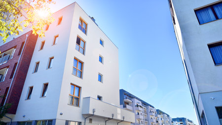 Low energy houses with apartments. Residential area with ecological and sustainable green residential buildings.の写真素材