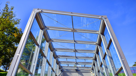 Modern building glass roof metal frame construction. Metal structure supporting glass roof.