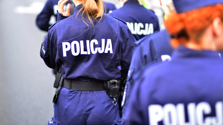 Police sign - logo on the back of the police uniform. Police.