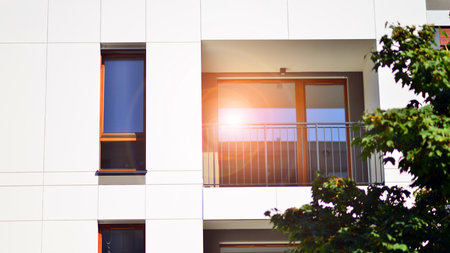 Green community. Eco apartment building saving energy and fresh air concept. Block of flats in...