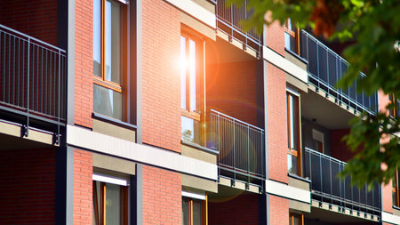Green community. Eco apartment building saving energy and fresh air concept. Block of flats in...