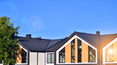Suburban neighborhood with condominium complex. Suburban area with modern geometric family houses....