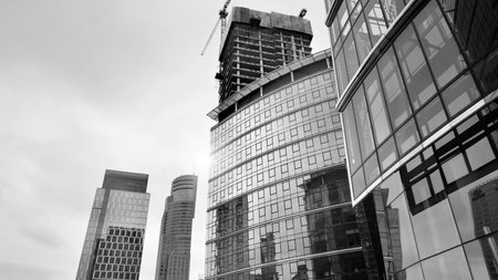 View of a skyscraper under construction. Modern architecture background. Building a high-rise...
