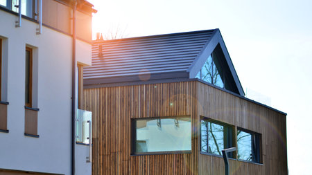 New single family houses in a new development area. Residential homes with modern facade. Terraced...